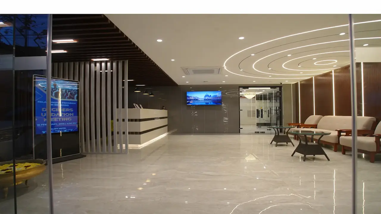 BLOFT Hotel- Lobby with curved ceiling lights and check-in counter