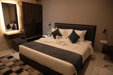 Executive room with king-sized bed and minimalist decor at Bloft Hotel Vellore