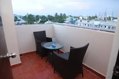 Private balcony seating with city view at Bloft Hotel Vellore.